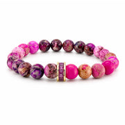 Bellissima Crystal Rondelle Gemstone Bracelet in Pink with Sea Sediment Jasper beads, gold-tone accents, and crystal centerpiece