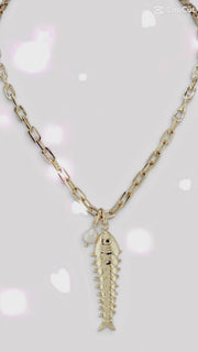 Love Lisa Maris Pearl Fish Charm Necklace shown with gold fish charm freshwater pearl accent and layering length options