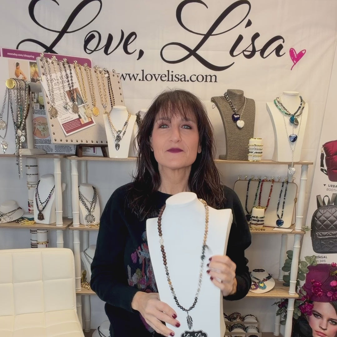 love lisa feather buddha gemstone wrap bracelet stacked on wrist earthy jasper and wood beads with feather and buddha charms