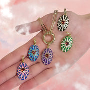 model holding assorted enamel heart charms for charm bar styling