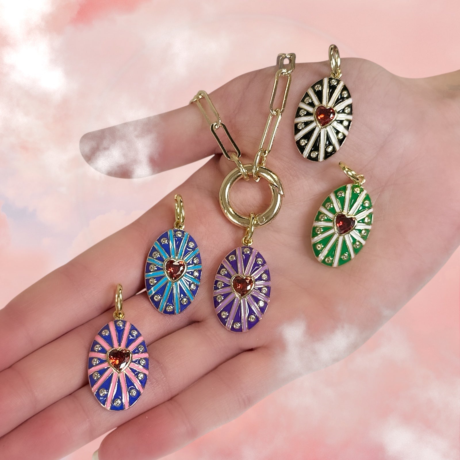 model holding assorted enamel heart charms for charm bar styling