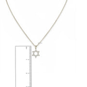 Star of David necklace with chain on a white background, accompanied by a ruler for scale.
