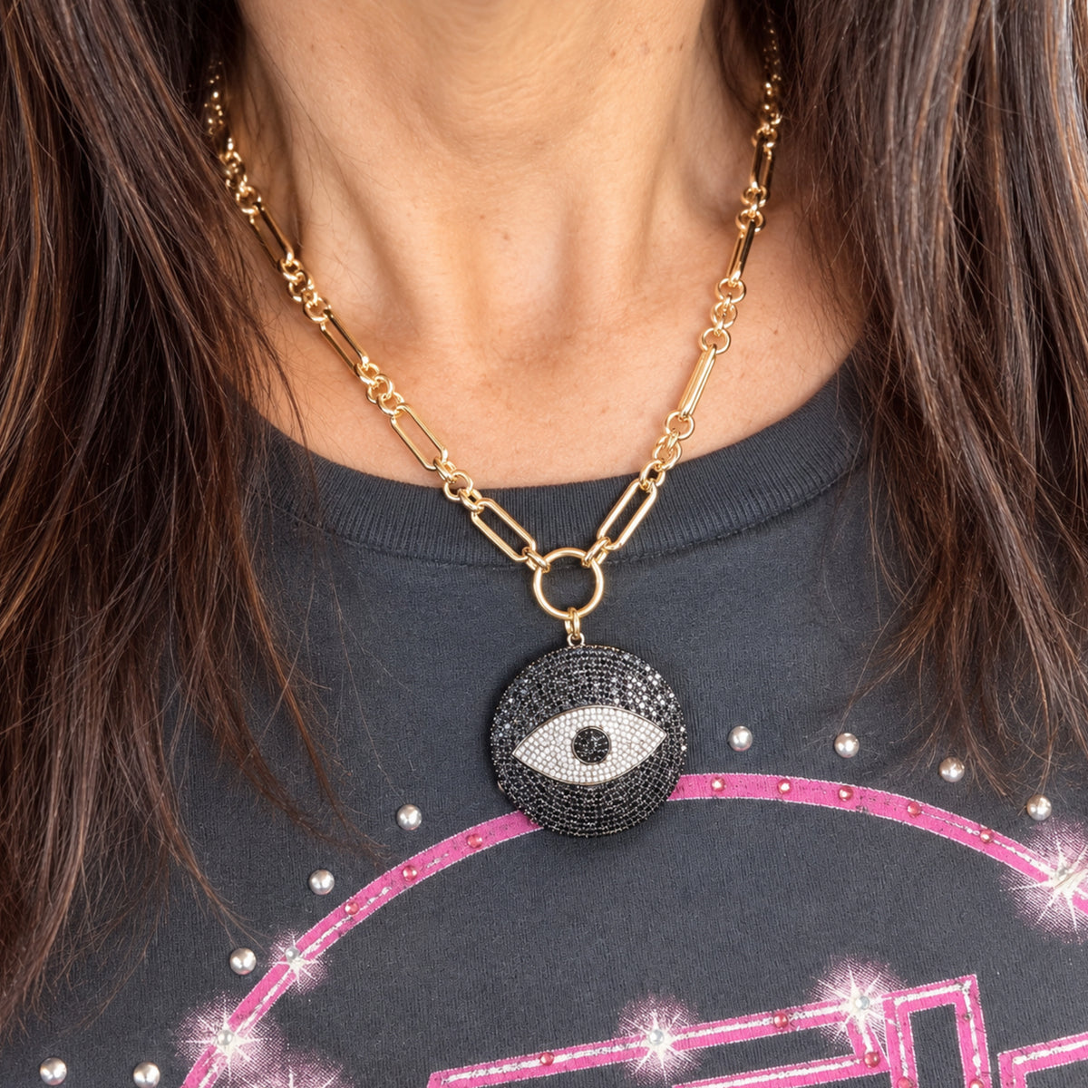 Love Lisa Return to Sender Evil Eye Protection Necklace worn at the neckline with oversized crystal evil eye medallion and statement link chain