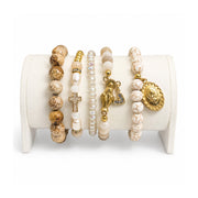 Love Lisa Rita and Ariana Padre Pio Blessing Bracelet Stack displayed with Padre Pio Blessed Mother cross praying hands and crystal heart charms