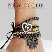 love lisa bow bracelet gunmetal on wrist