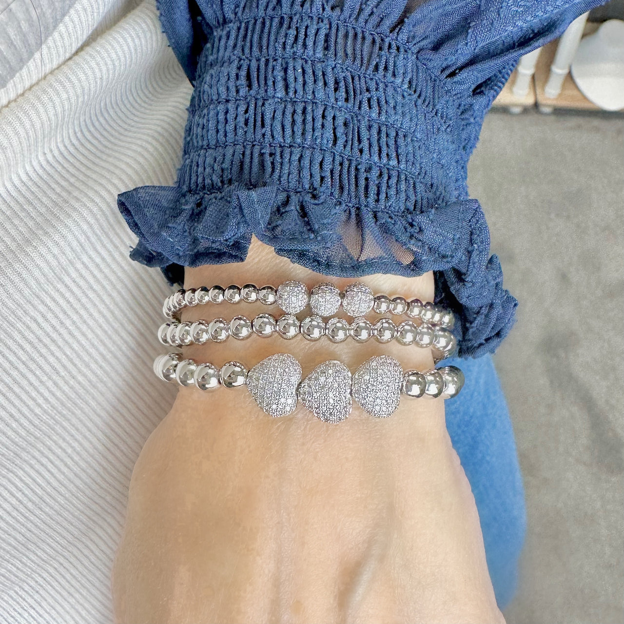 Lisa wearing the robin triple pave beaded bracelet