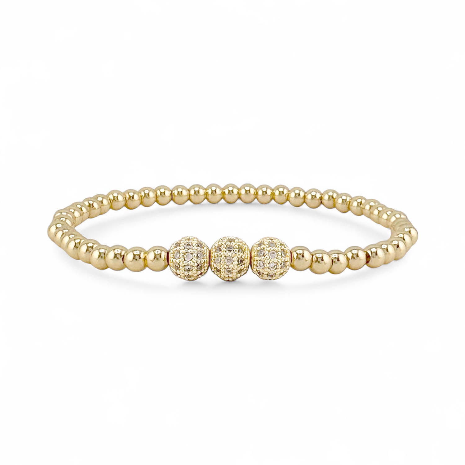 Gold beaded bracelet with three larger gold beads on a white background
