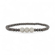 Black beaded bracelet with silver clasp on a white background