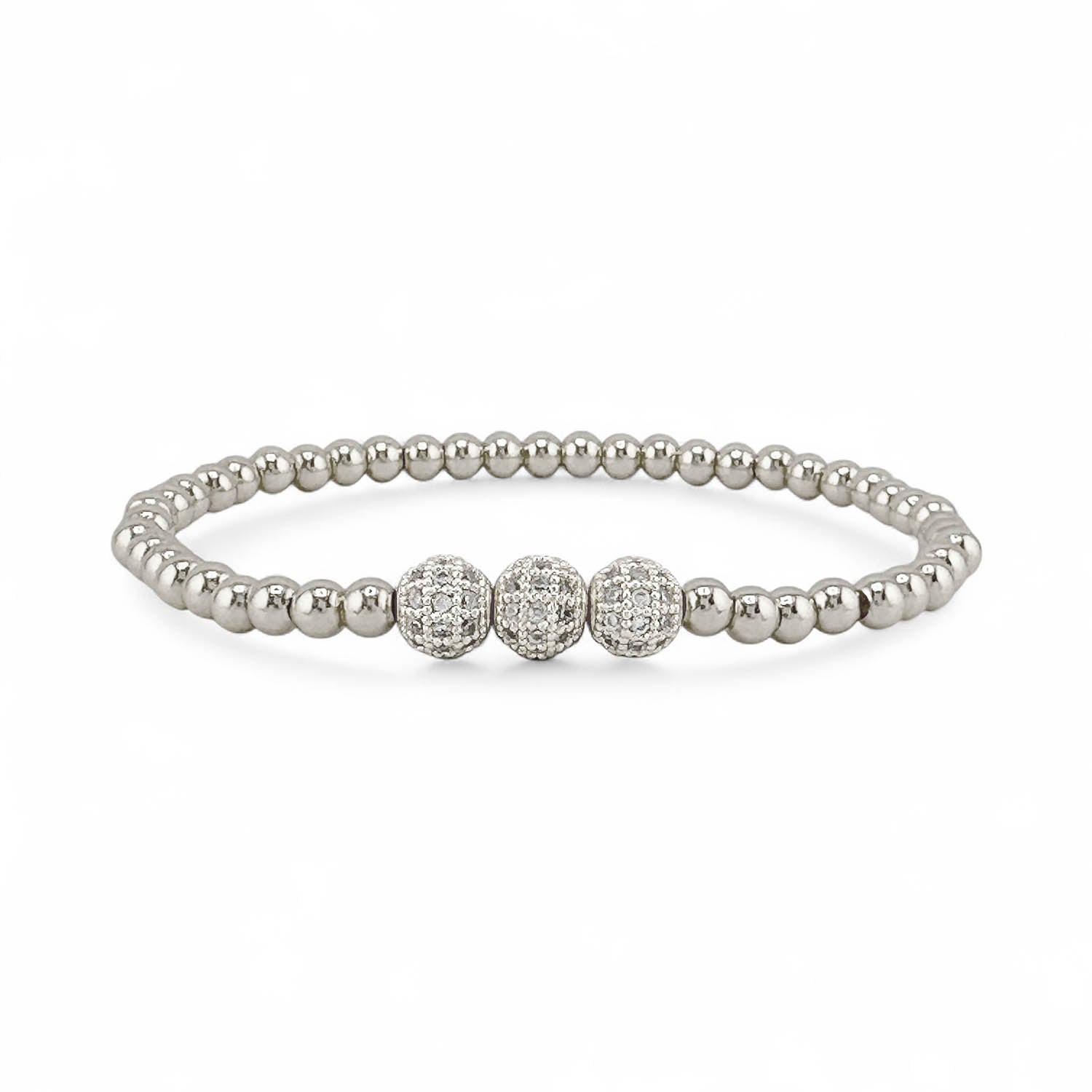 Silver beaded bracelet with three diamond-studded beads on a white background