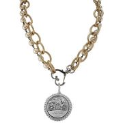 Necklace with gold chain, pearl beads, and silver medallion on a white background