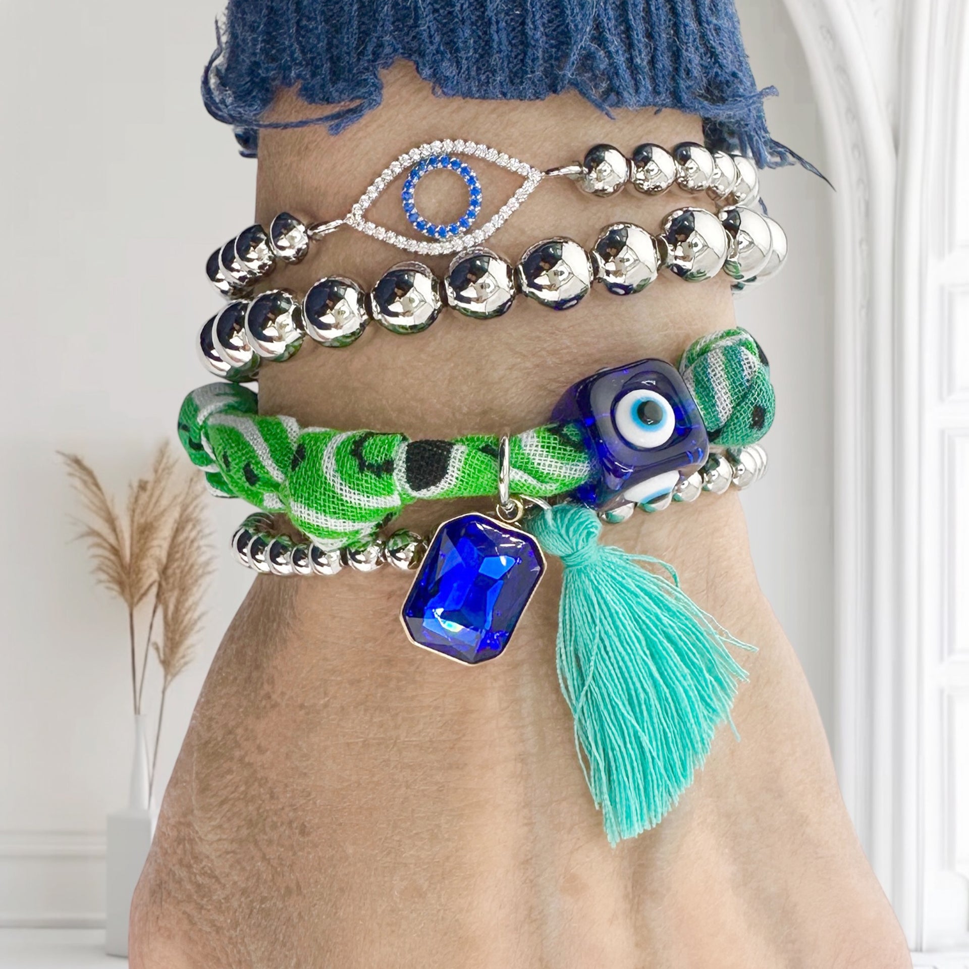 Arm stacked with Love, Lisa Roxie Bandana Charm Bracelets in assorted colors and charms
