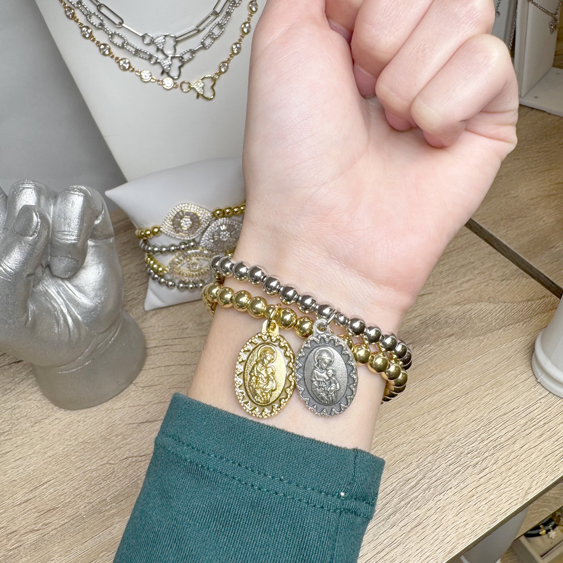 Love Lisa saint anthony beaded bracelet worn on wrist silver stretch bracelet with saint anthony medal