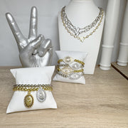 saint anthony beaded bracelet shown on jewelry display with medal religious bracelet gift