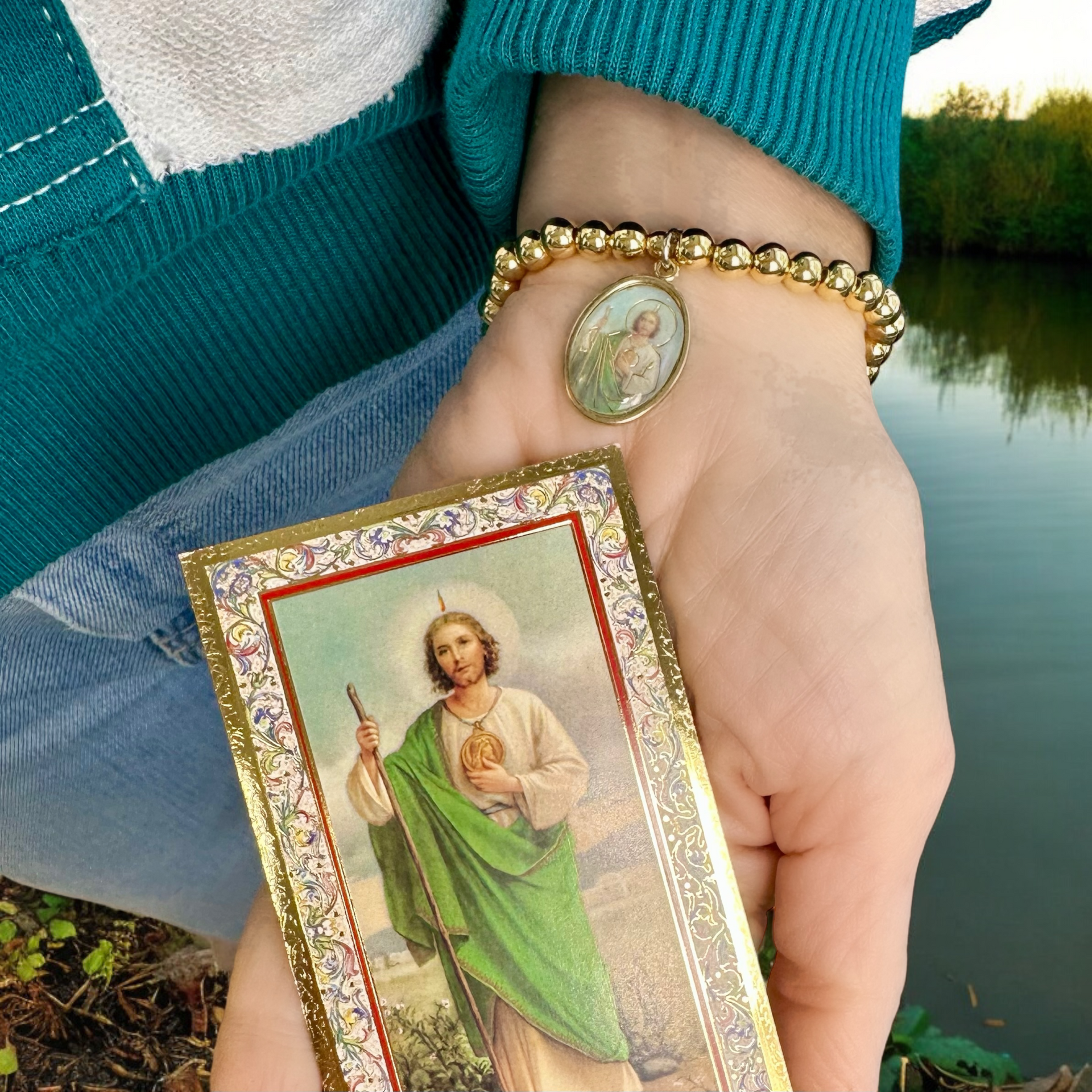 Love Lisa saint jude beaded bracelet worn in hand with prayer card green saint jude medal bracelet for hope and healing