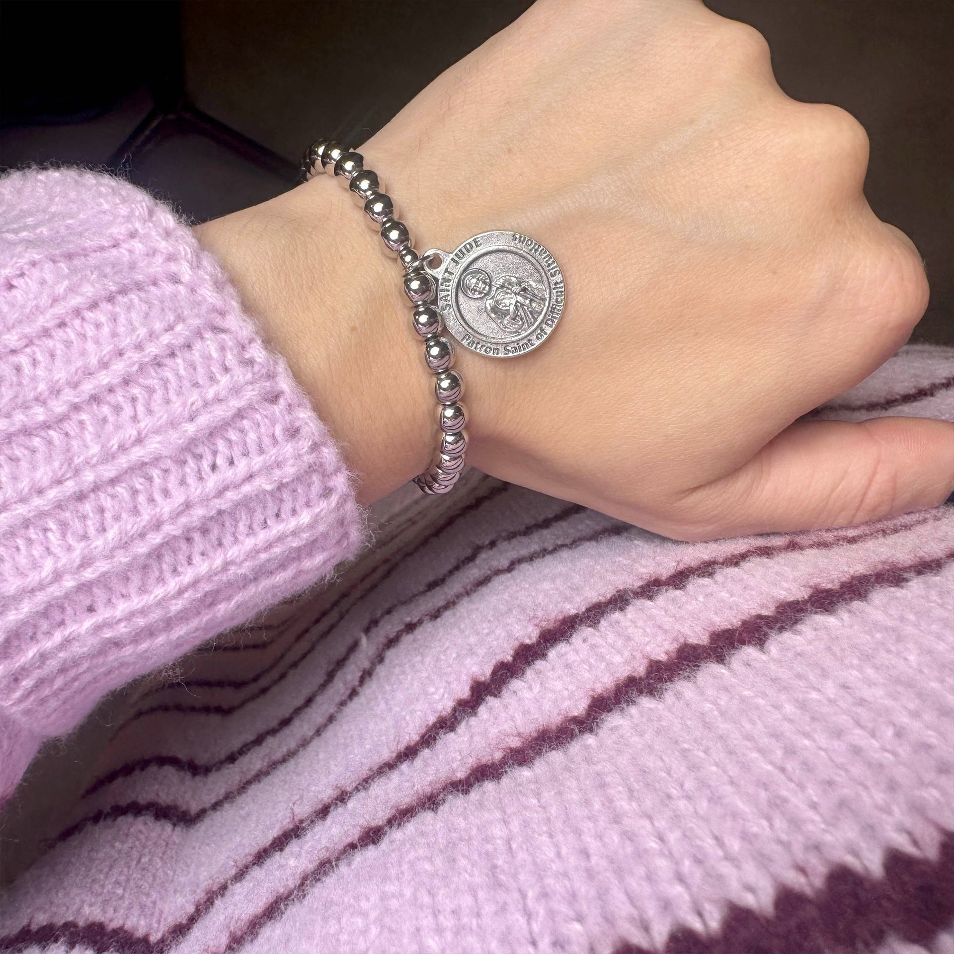 Love Lisa saint jude bracelet worn on wrist beaded stretch bracelet with medal for hope faith and encouragement