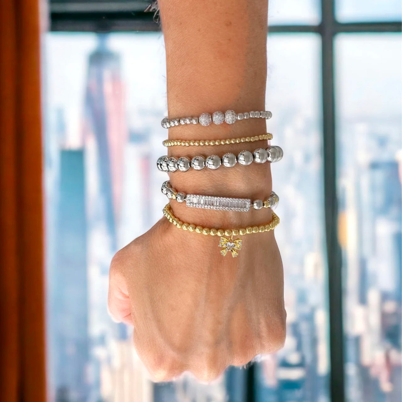 Love Lisa Samantha Bow Bracelet on wrist stacked beaded bracelet gift for her