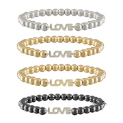 Set of four beaded bracelets with 'LOVE' charm in silver, gold, and black on a white background