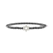 Black beaded bracelet with a star-shaped clasp on a white background