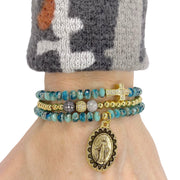 sandy miraculous medal bracelet stack worn on wrist turquoise beads