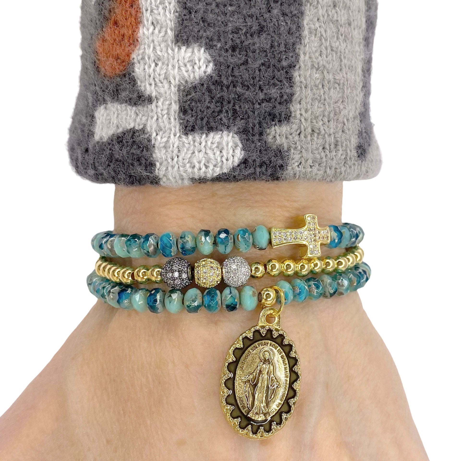 sandy miraculous medal bracelet stack worn on wrist turquoise beads