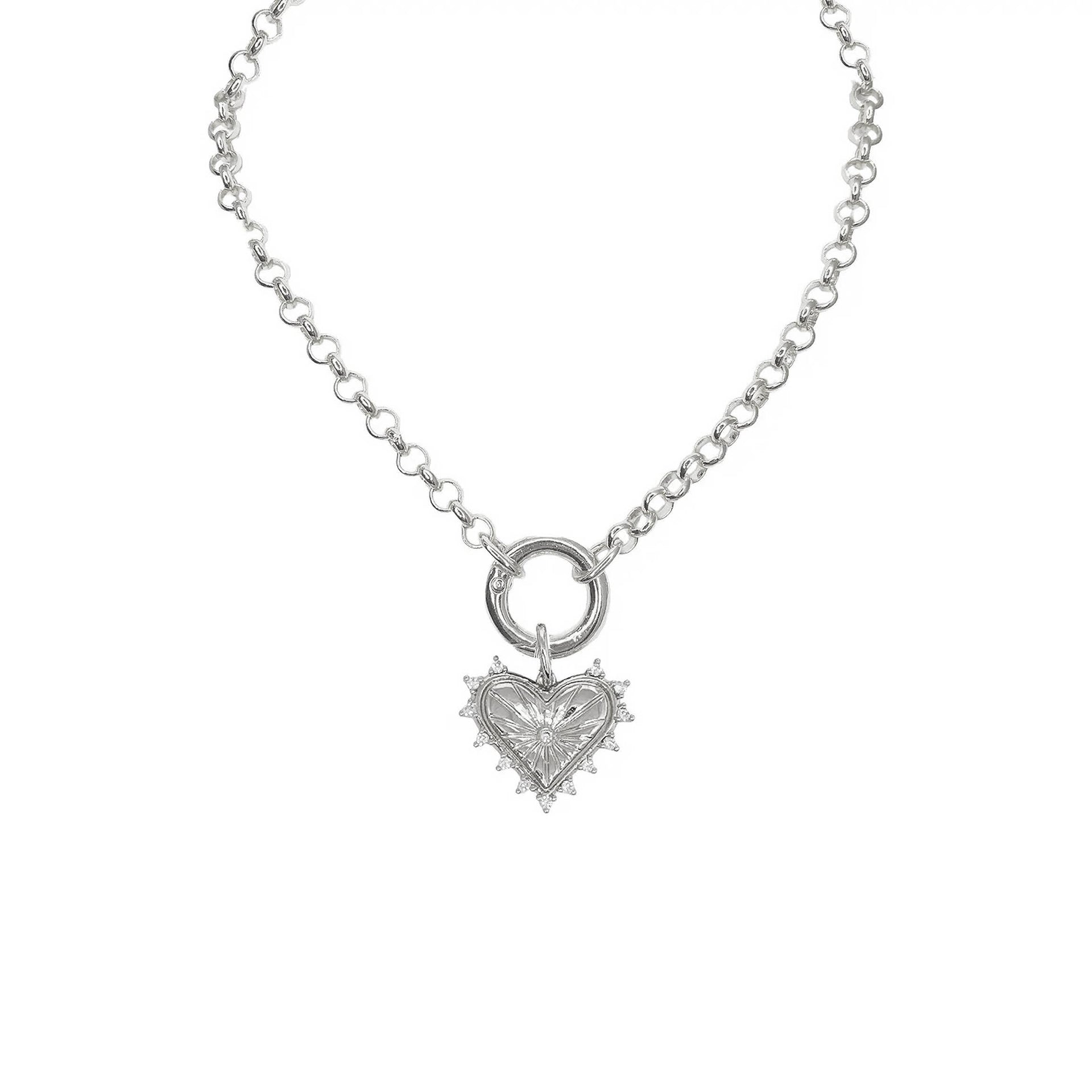 silver sarah jessica parker heart necklace on white background