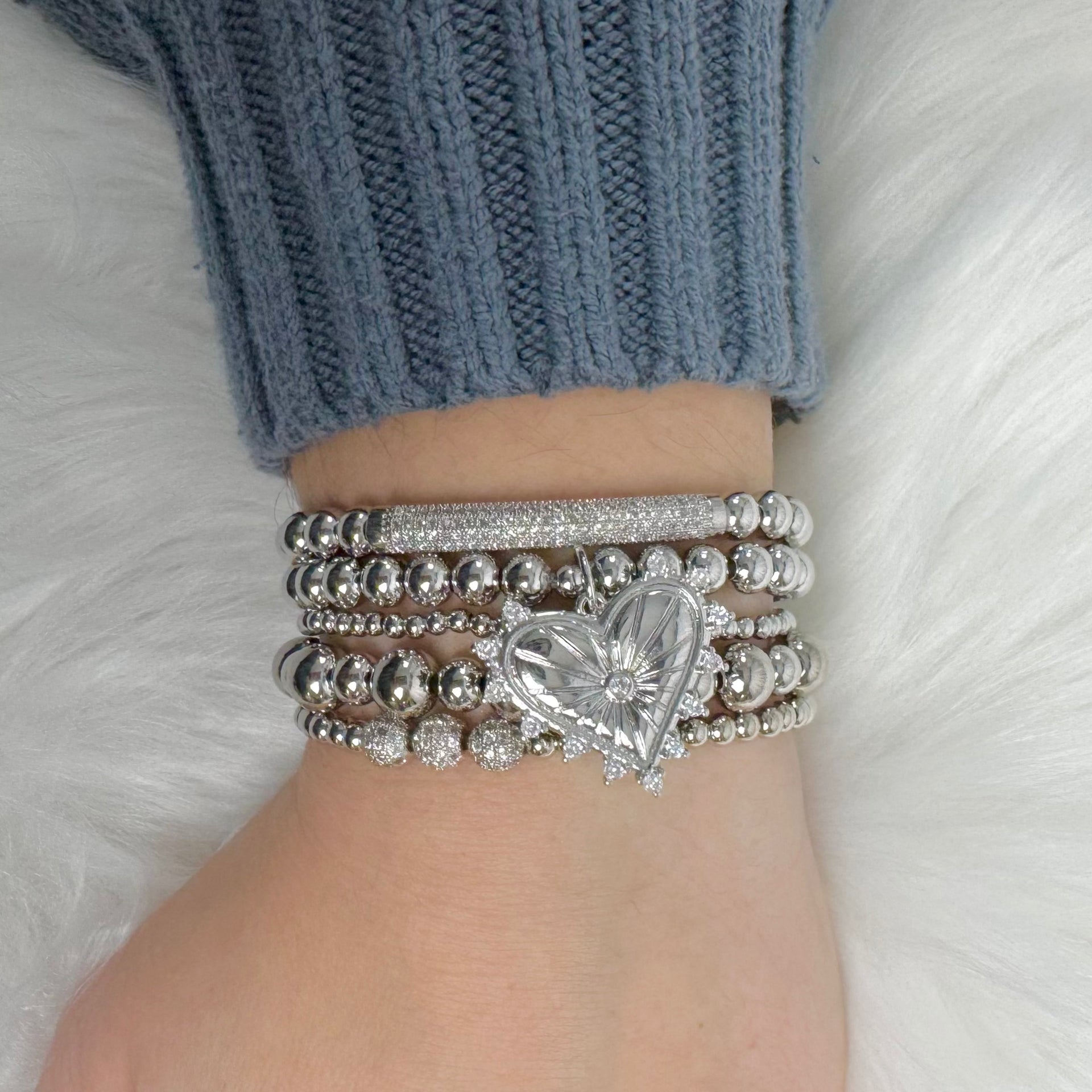 love lisa heart charm bracelet stack on wrist