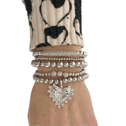 love lisa beaded heart charm bracelet styled on wrist layered jewelry look