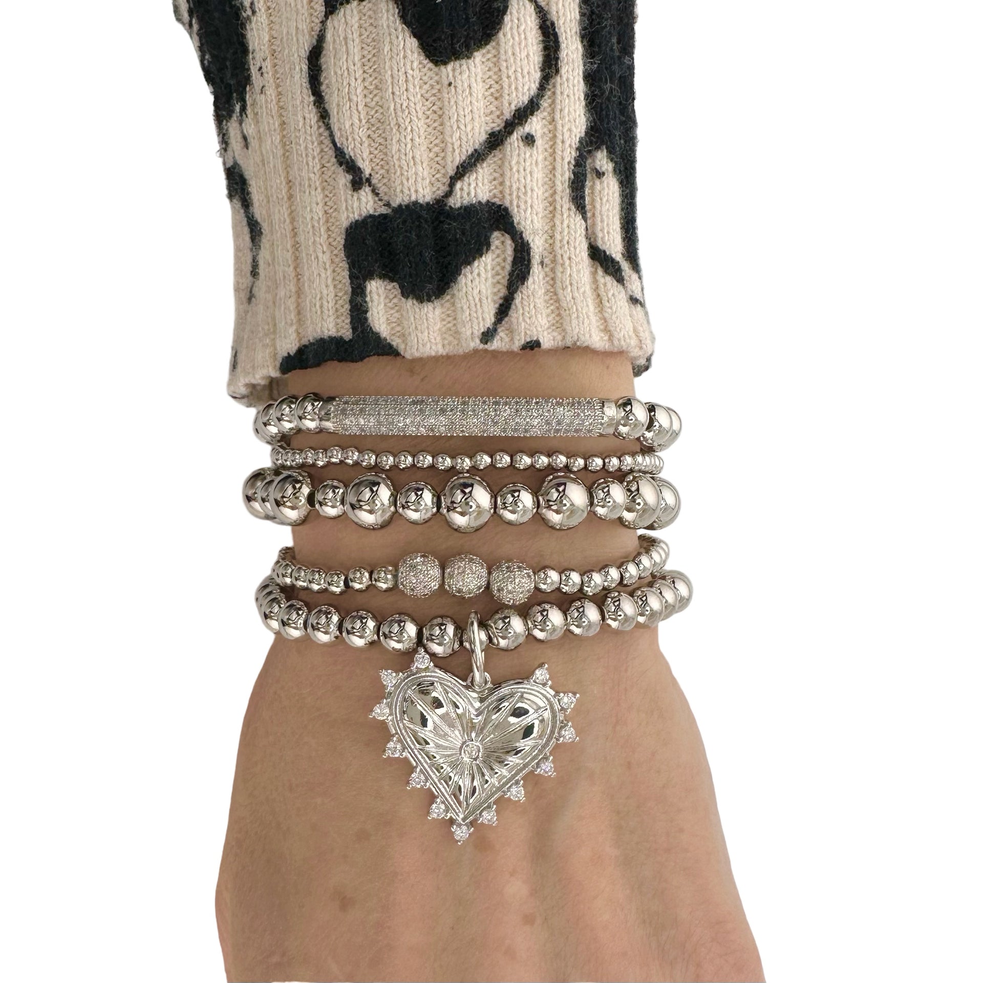 love lisa beaded heart charm bracelet styled on wrist layered jewelry look