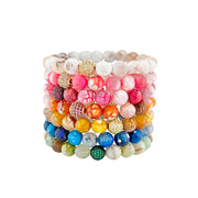 Stack of colorful Scarlett Pavé Gemstone Beaded Bracelets with faceted stones and pavé beads