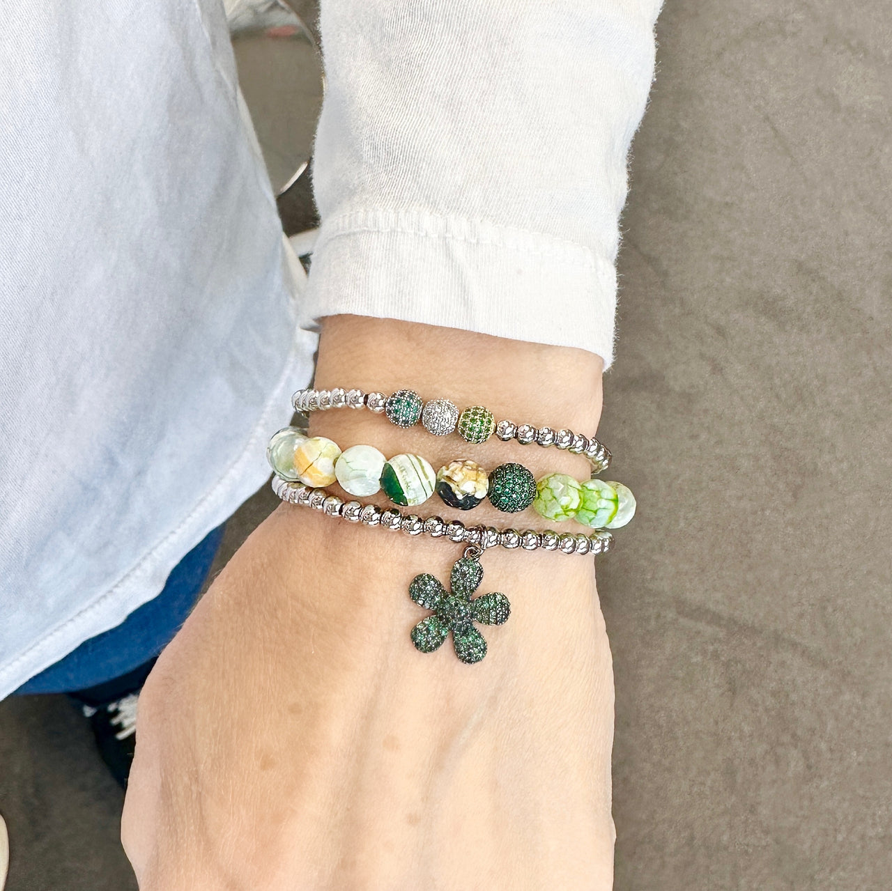 scarlett pave fire agate gemstone bracelets stacked  with flower pave charm bracelet and robin triple pave beaded bracelet