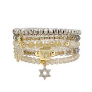 Shalom Blessings Bracelet Stack in gold and champagne with faceted beads symbolic charms and elastic fit measuring 6.85 inches