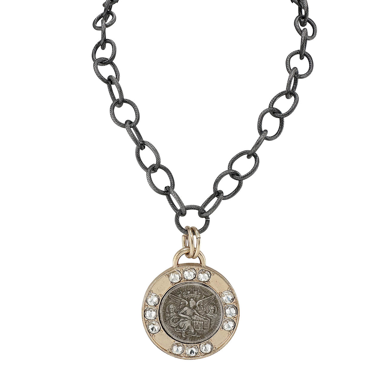 Necklace with a round pendant featuring a fairy emblem on an oxidized chain.