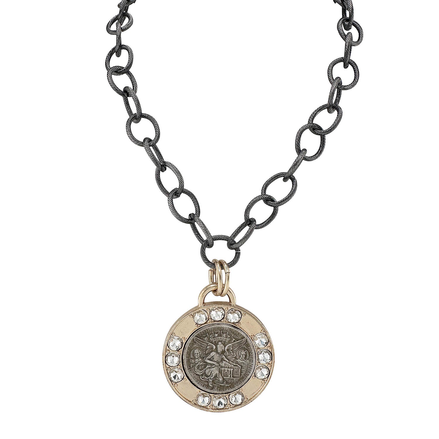 Necklace with a round pendant featuring a fairy emblem on an oxidized chain.
