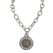 Silver chain necklace with a round pendant featuring an angel design on a white background