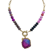 A Sherry Raspberry Druzy Necklace featuring a combination of gemstone beads in various shapes and a gold-toned chain.