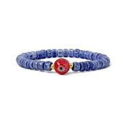 Sienna Ceramic Evil Eye Stretch Bracelet in blue with glossy ceramic beads gold-tone accents and ceramic evil eye focal bead