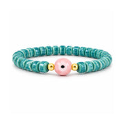 Sienna Ceramic Evil Eye Stretch Bracelet in teal with glossy ceramic beads gold-tone accents and ceramic evil eye focal bead