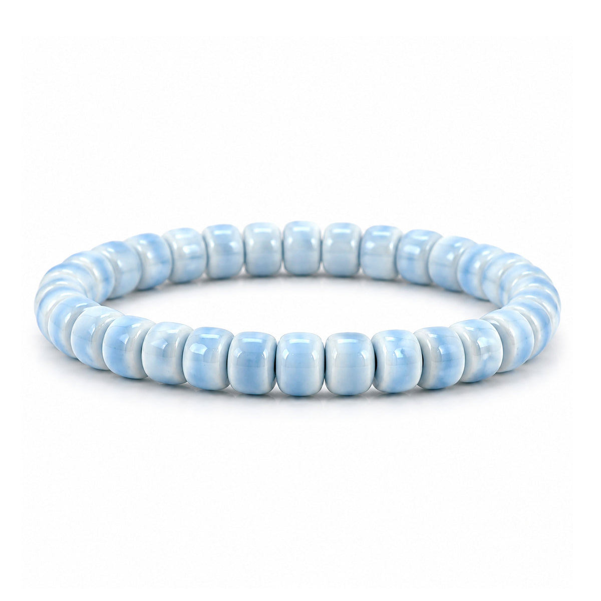 A beaded stretch bracelet made of light blue ceramic round beads, displayed on a clean white background.