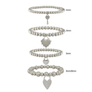 Lock and key heart charm stretch bracelets shown individually elastic fit layered bracelet options
