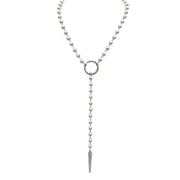 Pearl necklace with a silver ring and pendant on a white background