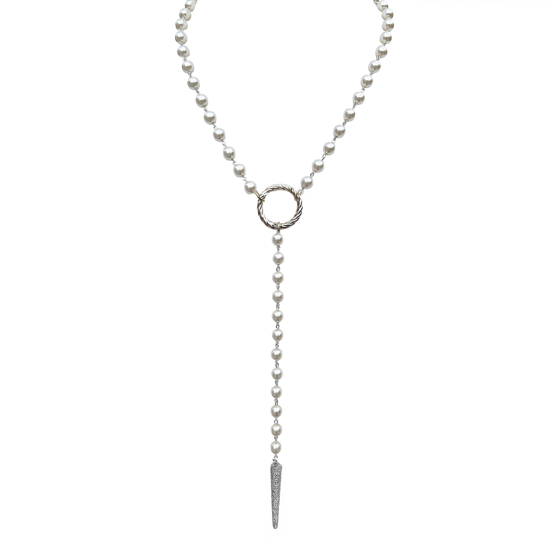 Pearl necklace with a silver ring and pendant on a white background