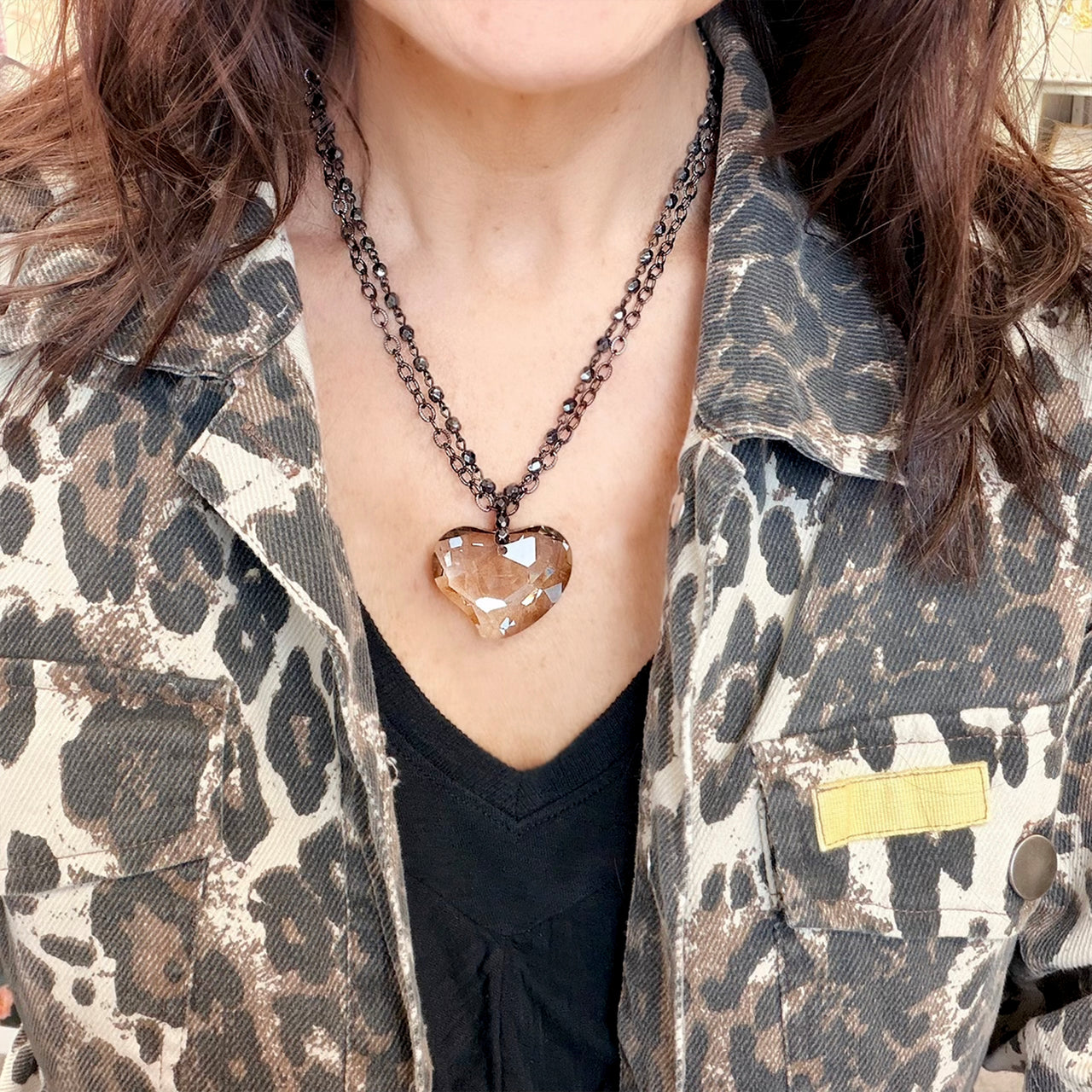 love lisa smokey glass heart double strand necklace on model layered gold chain with smokey heart pendant