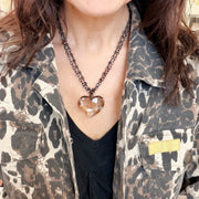love lisa smokey glass heart double strand necklace on model layered gold chain with smokey heart pendant