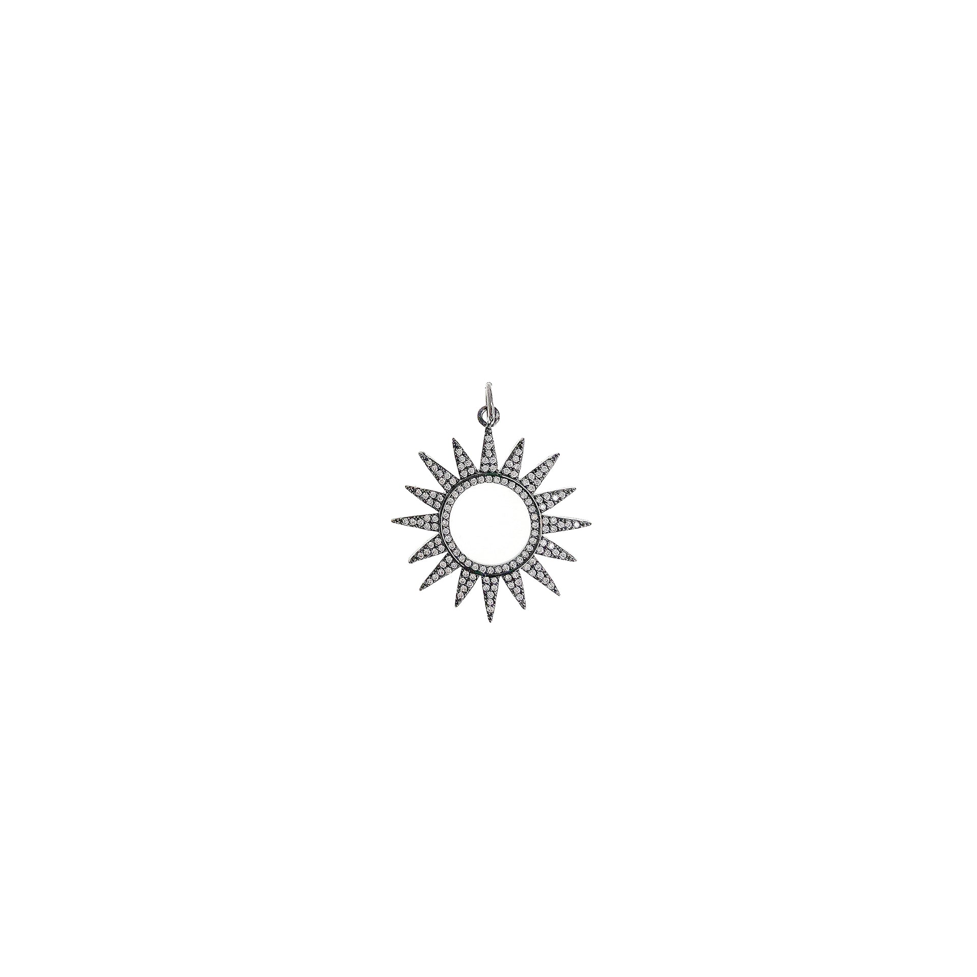solar sunburst charm with pave crystal details in gunmetal finish