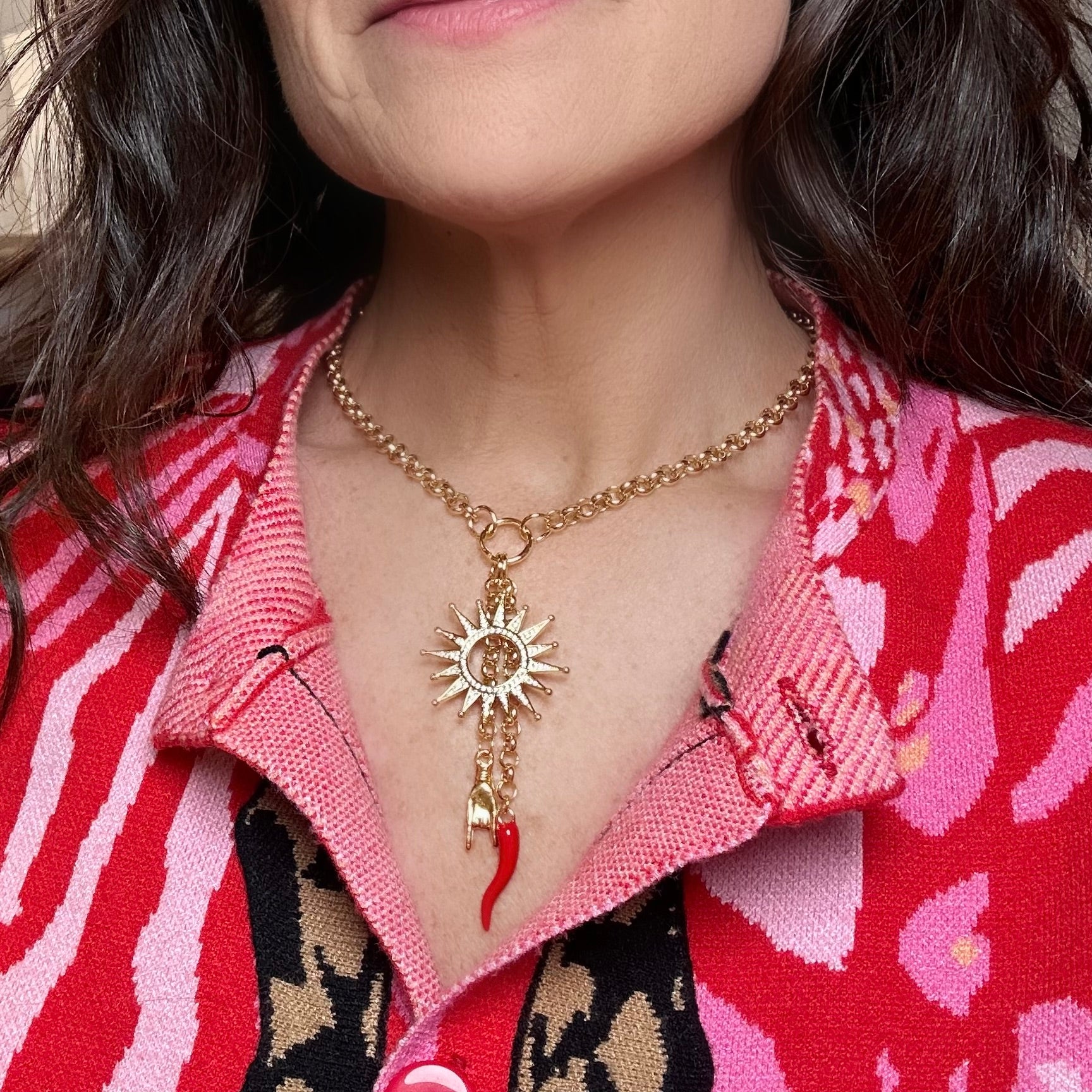 love lisa sole amuleto italian horn necklace worn with red blouse