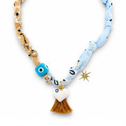 Soleil bandana charm necklace Coastal Sky with blue neutral scarf fabric evil eye beads tassel heart charm and layered charm details