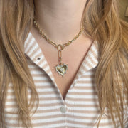 Sophia Heart Medallion Necklace with bold gold chain and dual heart pendant