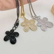 sparkling bloom charm styled on love lisa clasp necklace