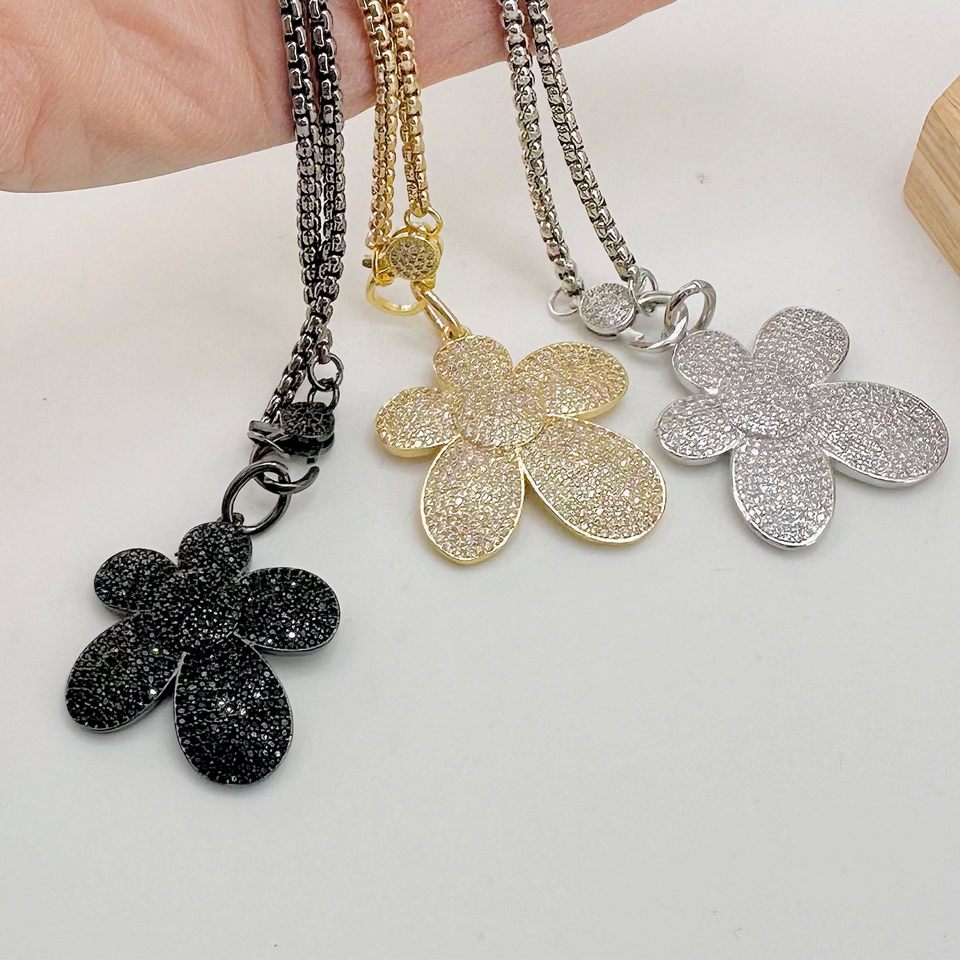 sparkling bloom charm styled on love lisa clasp necklace