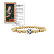 Love Lisa Saint Gerard beaded bracelet displayed with Saint Gerard prayer card